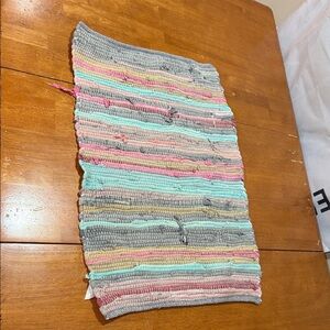 Woven multicolored rag rug.